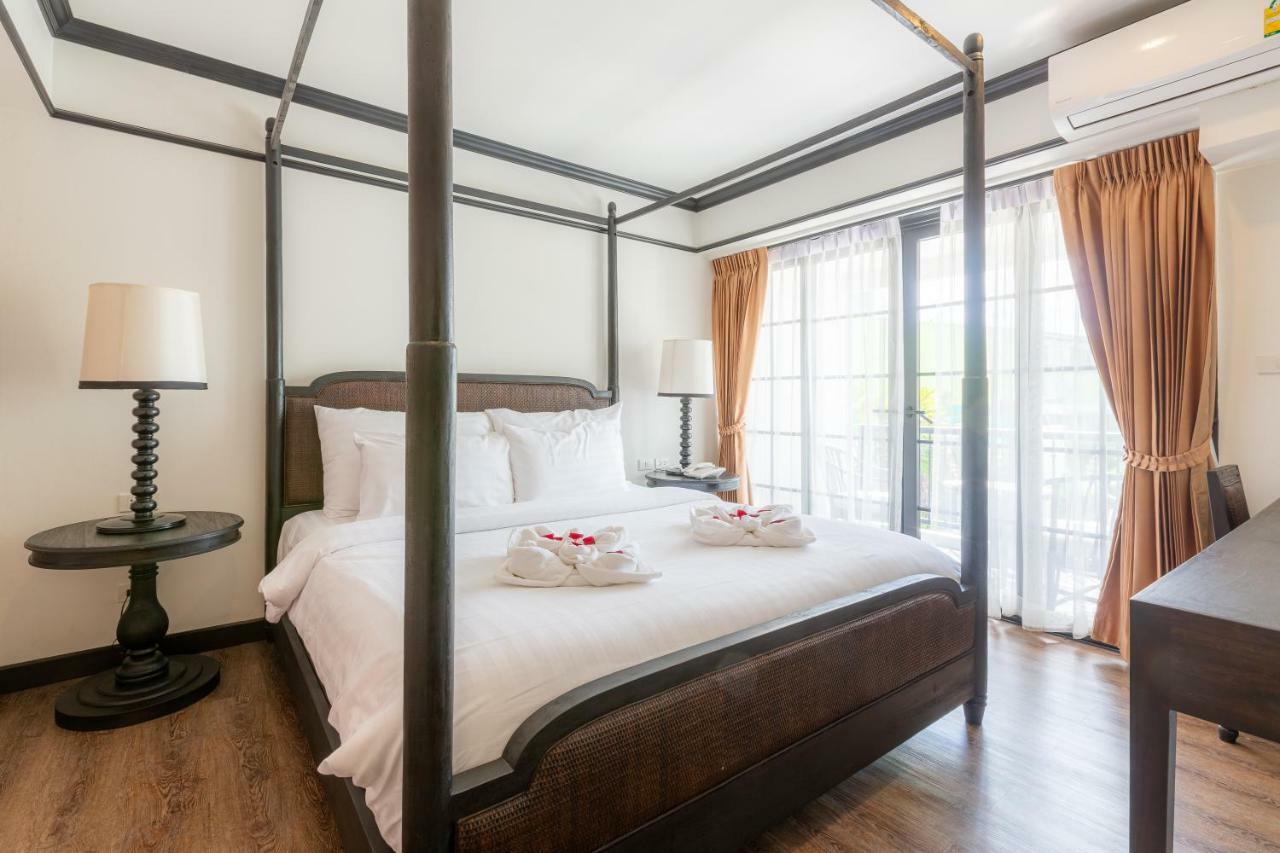莫拉精品酒店【SHA Extra Plus】 清莱 外观 照片 A four-poster bed